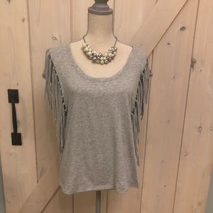 Unique Short sleeve top with side tassels.